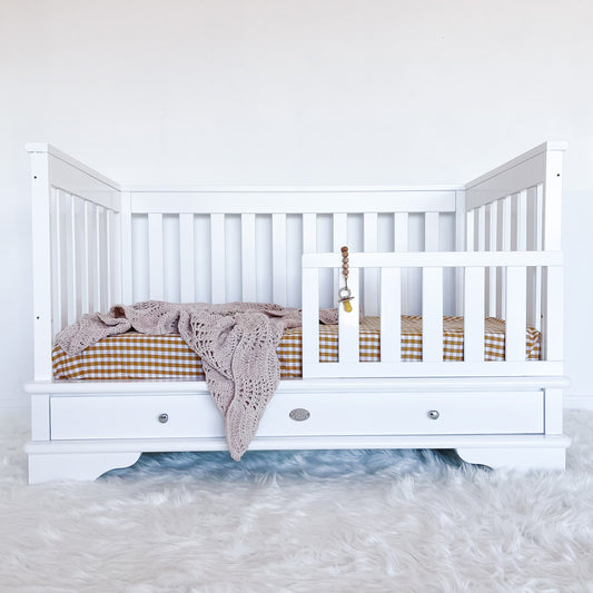 Contemporary cot toddler bed with toddler rail attached