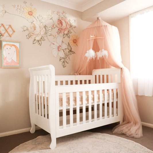 5-in-1 Sleigh Cot with front rail lowered