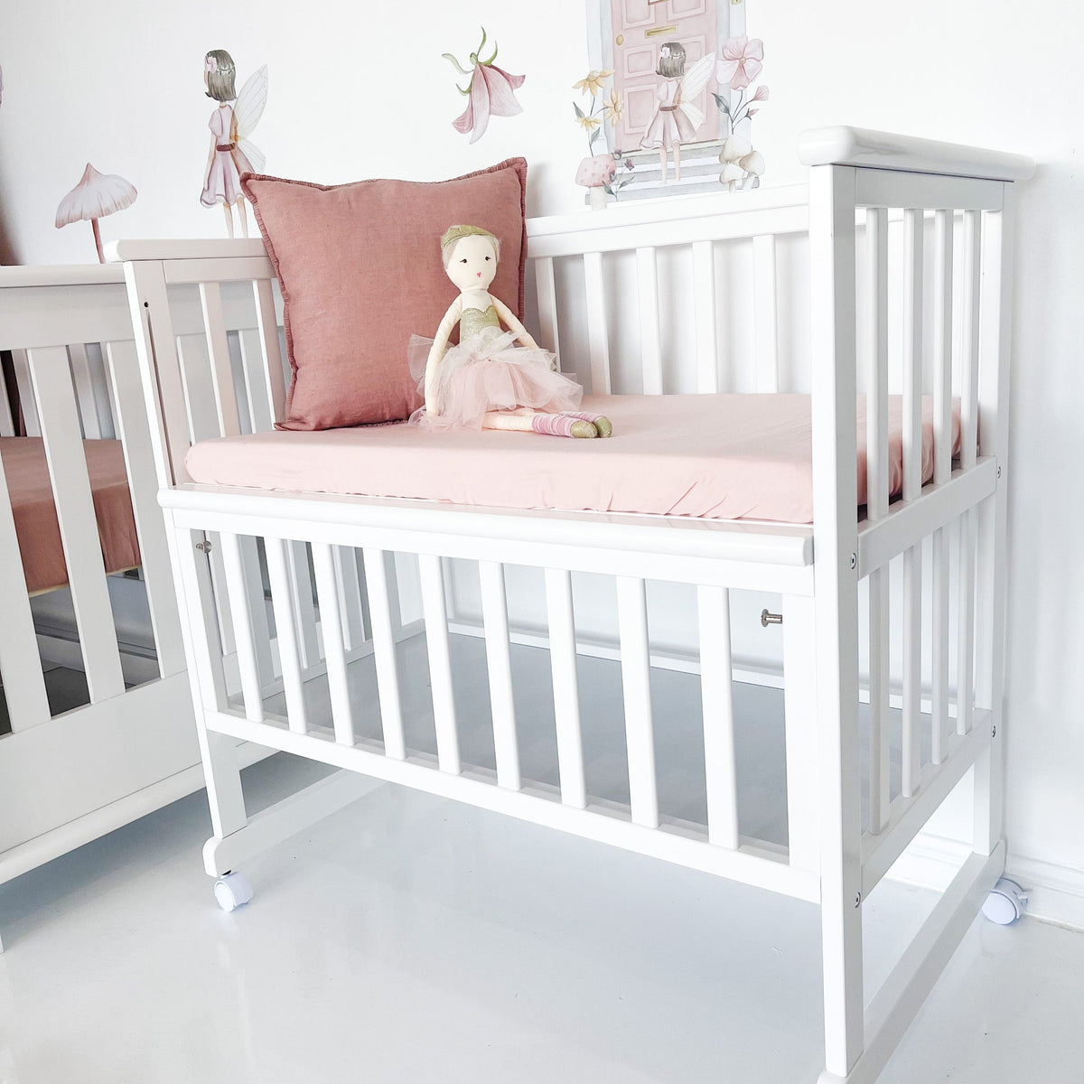 Bedside bassinet with front rail lowered