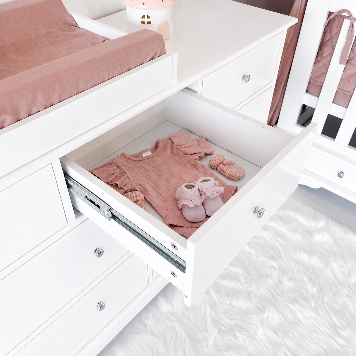 High-angle open-drawer view of Contemporary seven-drawer dresser with centred silver knobs
