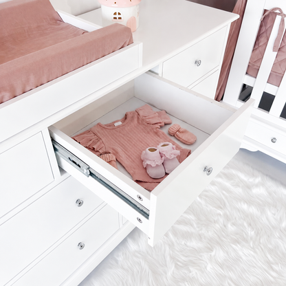 High-angle open-drawer view of Contemporary seven-drawer dresser with centred silver knobs