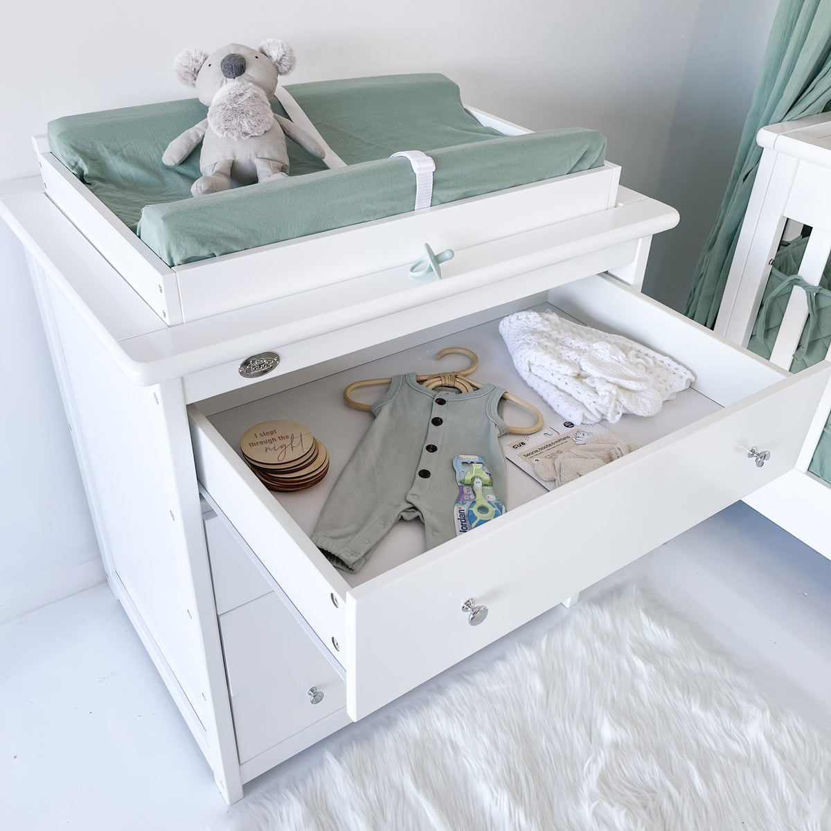 4 drawer chest with top drawer open and change mat shown